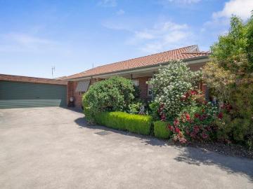 Spacious brick unit in prime location!