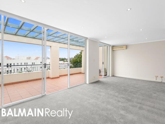 Spacious & Bright Two Bedroom Apartment with Elevated Water Glimpses