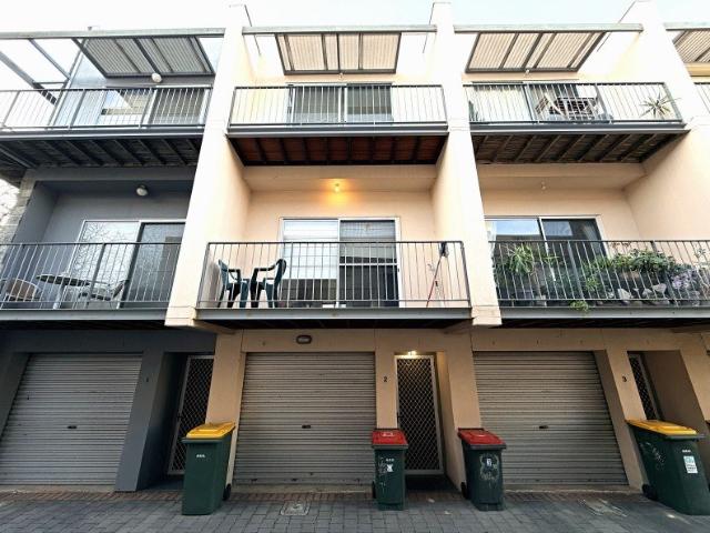 Spacious City Townhouse Offering Flexible Living and Secure Parking
