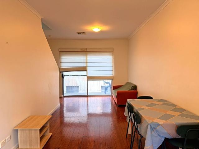 Spacious City Townhouse Offering Flexible Living and Secure Parking