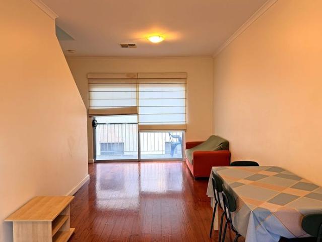 Spacious City Townhouse Offering Flexible Living and Secure Parking