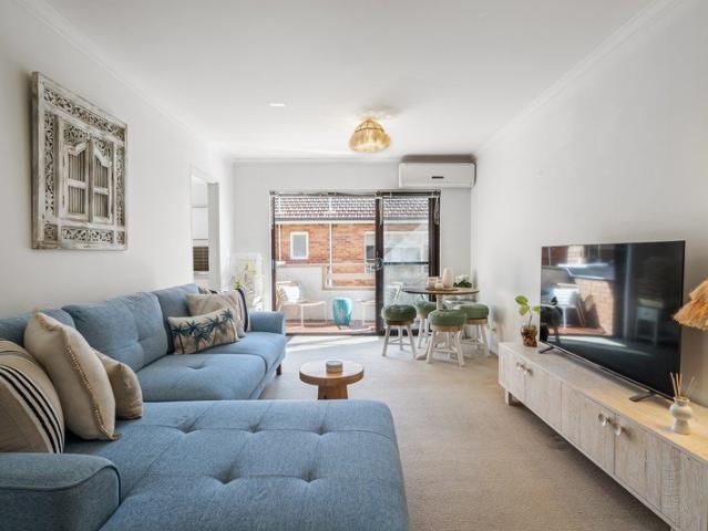 Spacious coastal apartment with rare two car convenience