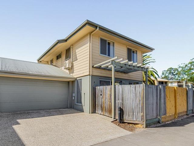 Spacious Corner Townhouse with House Like Living & Parking for Four Cars