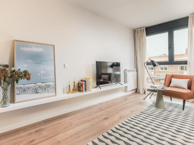 Spacious designer apartment in a building with swimming pool