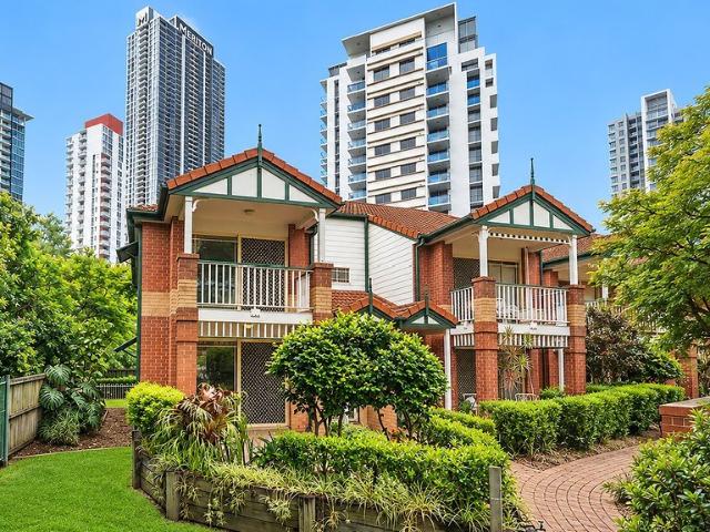 Spacious End Row Townhouse with Pool Views & Private Courtyard