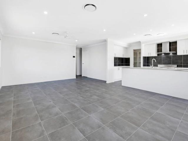 SPACIOUS FAMILY HOME WITH OPEN KITCHEN LIVING DINING. SEPARATE CARPETED MEDIA ROOM. DUCTED AIR CON THROUGHOUT. SECURITY SCREENS ON WINDOWS