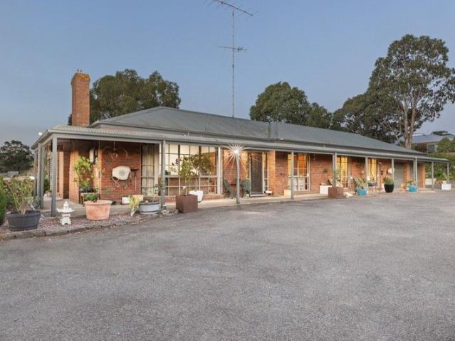 Spacious Family Home with Endless Potential on Over 1 Acre of Prime Land
