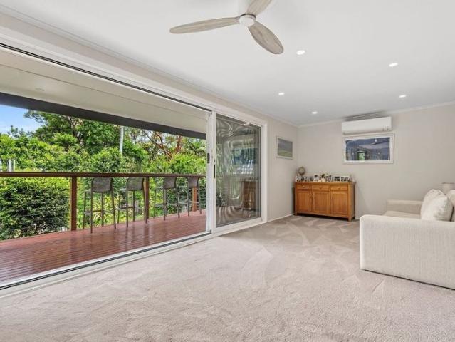 Spacious family home with entertainer's deck and lush gardens