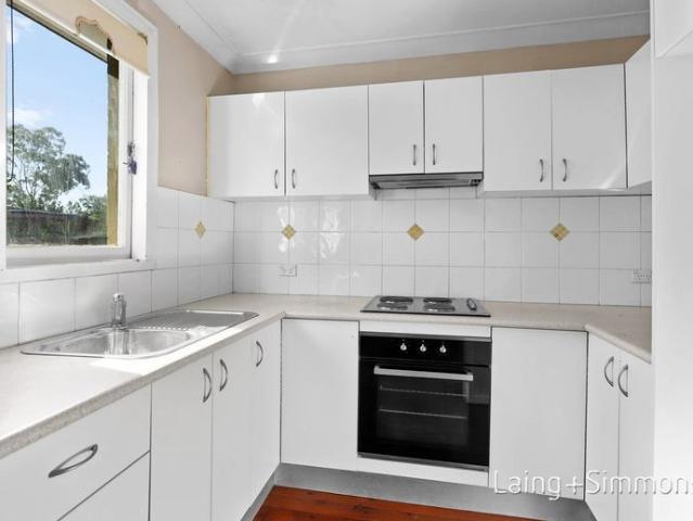 Spacious Family Home with Garage and Enclosed Backyard!