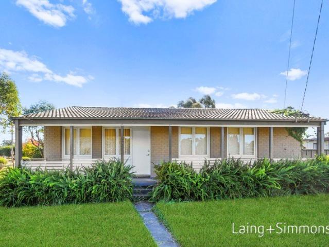 Spacious Family Home with Garage and Enclosed Backyard!