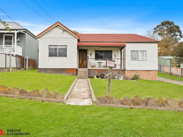 Spacious Family Home with Large Yard & Rear Lane Access