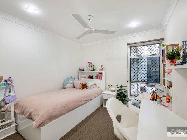 Spacious Family Home with Parkland Access and Triple Bay Shed in Prime Kalkie Location!