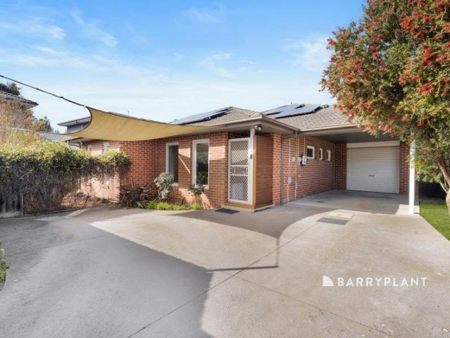 Spacious Family Home with Two Living Areas & Private Driveway!