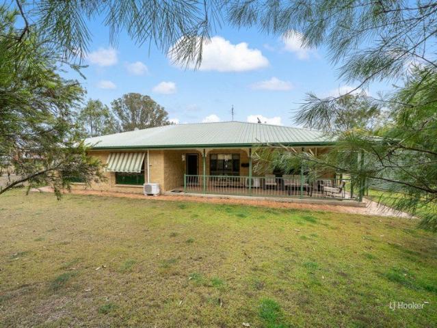 Spacious Family Home on 2 Hectares with Garages & Usable Acreage