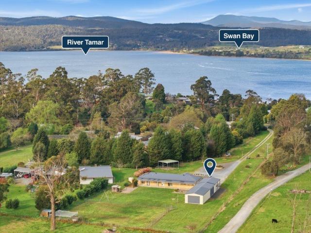 Spacious Family Living on approximately 1.7 acres in beautiful Gravelly Beach