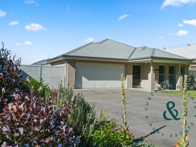 Spacious family living opposite bush at The Bower