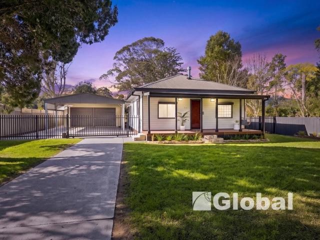 Spacious Family Living with Exceptional Garaging & Secure Gated Entry