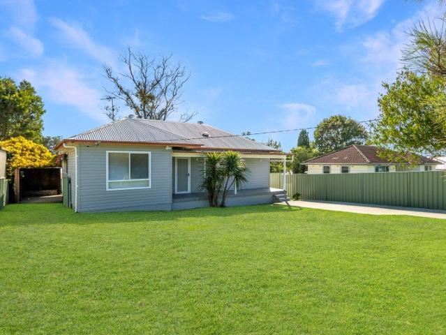 Spacious Family Living with High Ceilings, Huge Yard & Entertainer's Deck