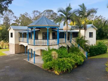 A Rare Gem completely flat acreage home with mountain views and future dual living potential