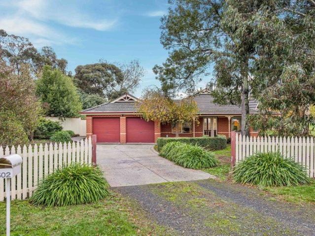 SPACIOUS FOUR BEDROOM FAMILY HOME WITH BUNGALOW ON FULLY MAINTAINED HALF ACRE