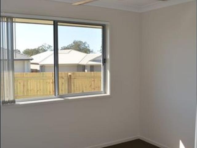 SPACIOUS FOUR BEDROOM HOME. OPEN KITCHEN LIVING DINING. FAMILY FRIENDLY BACK YARD