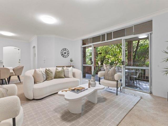 Spacious full brick living, peacefully positioned with everything in walking reach