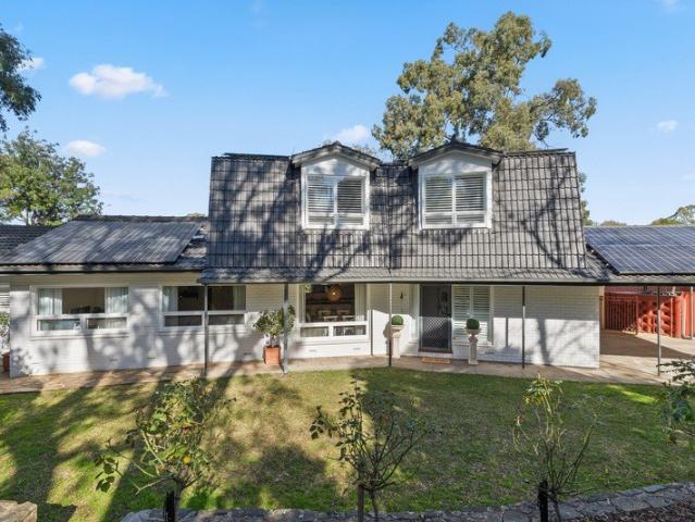 Spacious Hamptons living with hills face views and poolside charm.