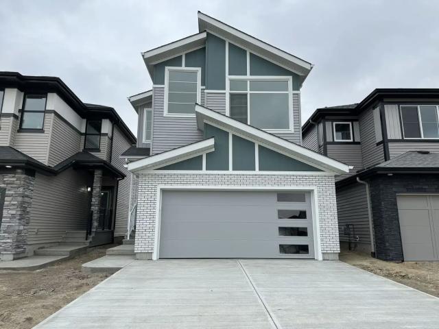 Spacious Kinglet Gardens Home with Double Garage & Fenced Backyard