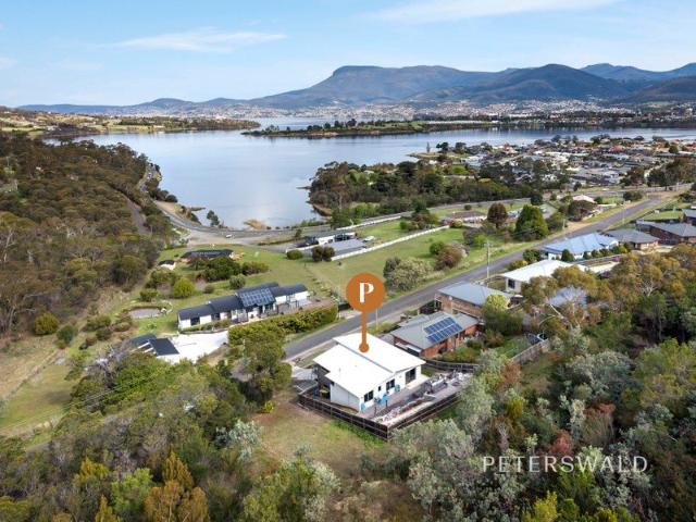 Spacious living with sweeping water views
