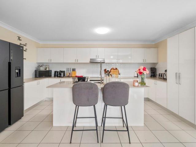 Spacious, Low Maintenance Living with a Kitchen That Steals the Show!