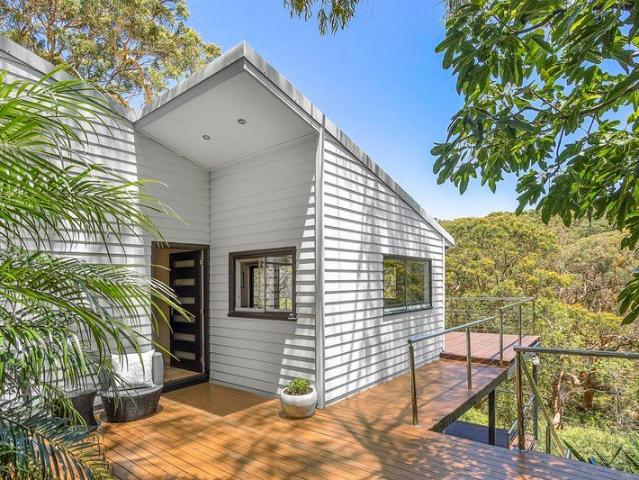 Spacious Modern Mid Century Home In Private Parkland Setting On 1347sqm