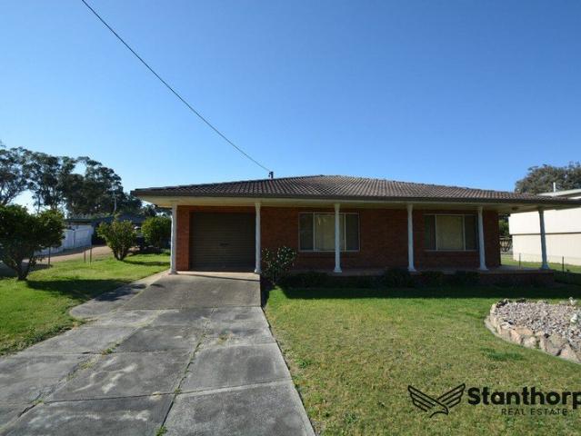Spacious One Bedroom Brick Home with Garages & Outdoor Living