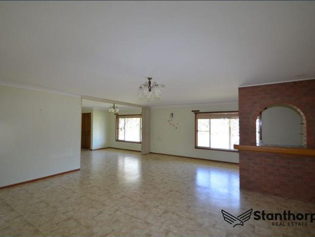 Spacious One Bedroom Brick Home with Garages & Outdoor Living