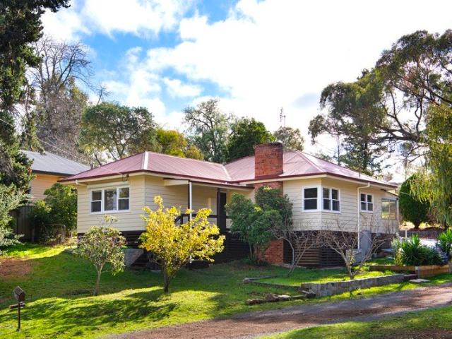 Spacious Park side Mid century Living with a Self Contained Studio on Over Half an Acre