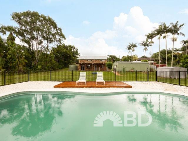 Spacious Renovated Acreage Home with Pool & Shed