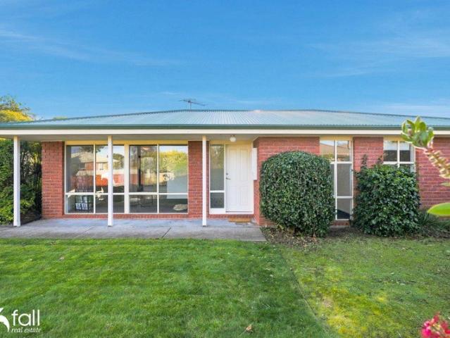 Spacious Single Level Brick Home with Exceptional Outdoor Living