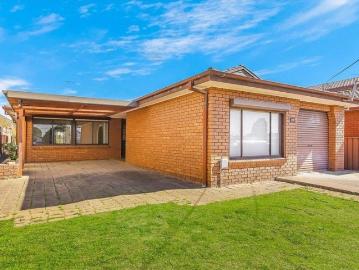 Spaciously Appointed Brick Family Residence in a Prime Location!
