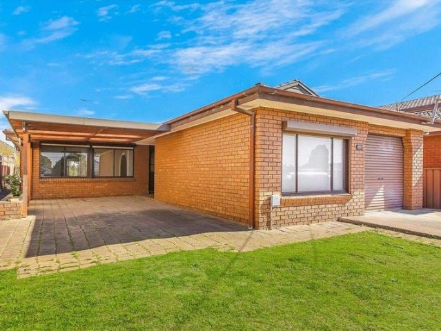 Spaciously Appointed Brick Family Residence in a Prime Location!