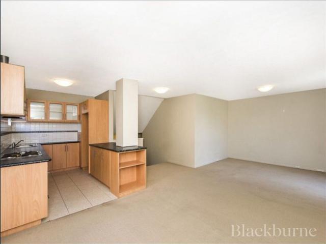 SPLIT LEVEL UNIT WITH COURTYARD!