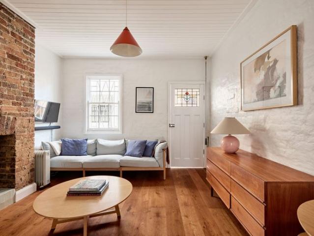 Split level laneway cottage with an open fireplace and private balcony in Surry Hills $1,200/week furnished inc bills