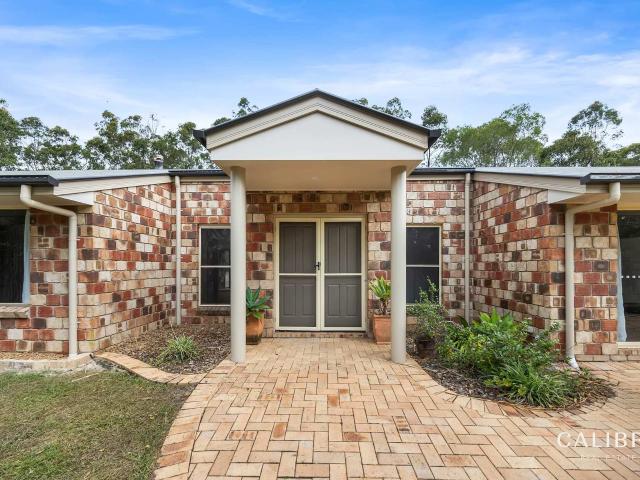 sprawling low set family ranch on 4 acres