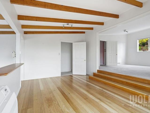 Sweeping Views, Flexible Living, Premier Sandy Bay Address!