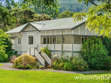 Storybook Homestead on 8.5 Acres with Dora Creek Frontage