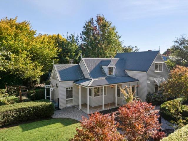 Storybook Inspired Home with Cathedral Ceilings & Stunning Gardens