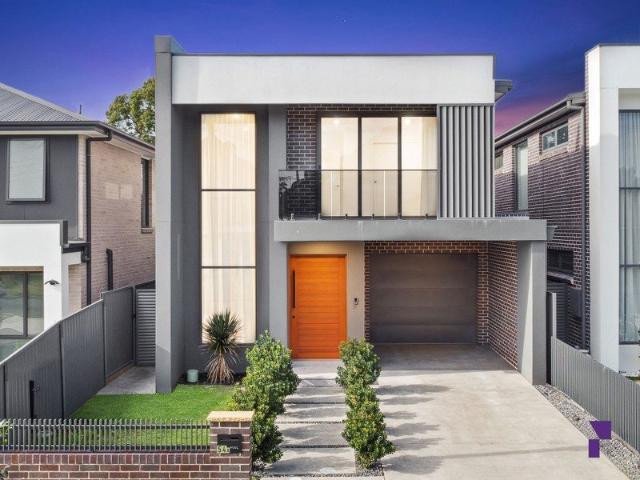State of the art brick residence reveals grand scale entertaining with inground pool