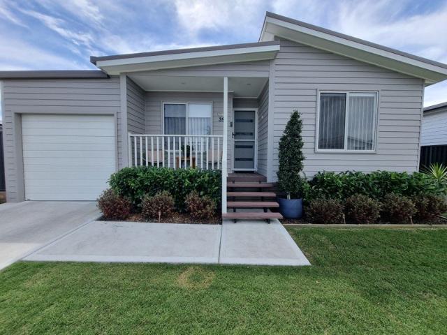 Near new stand alone Villa style home in an over 50's lifestyle land lease resort