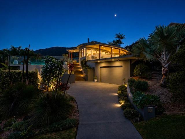 Start your day in architectural serenity, coffee in hand, as migrating whales drift across the Pacific horizon