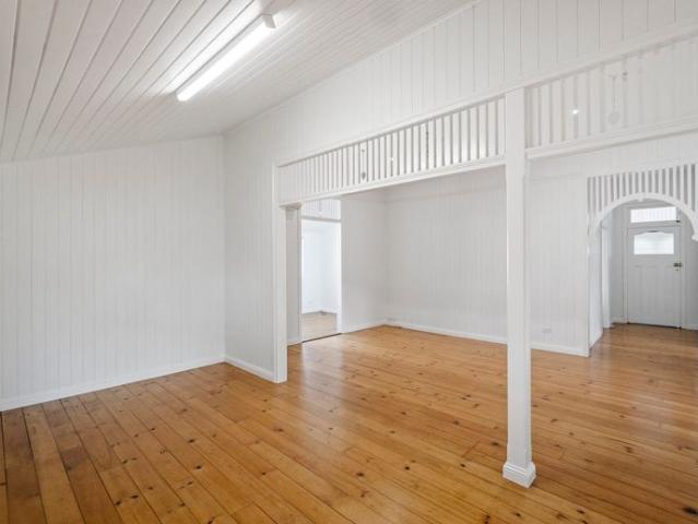 Step into the timeless elegance of this expansive Queenslander, where classic beauty meets modern comfort