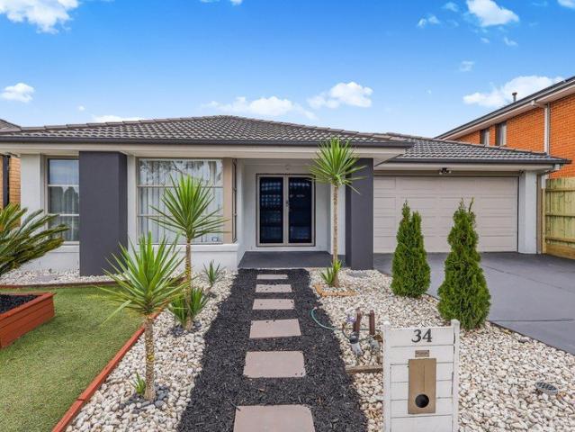 Step through the grand double front doors into a wide and welcoming entrance that instantly feels like home