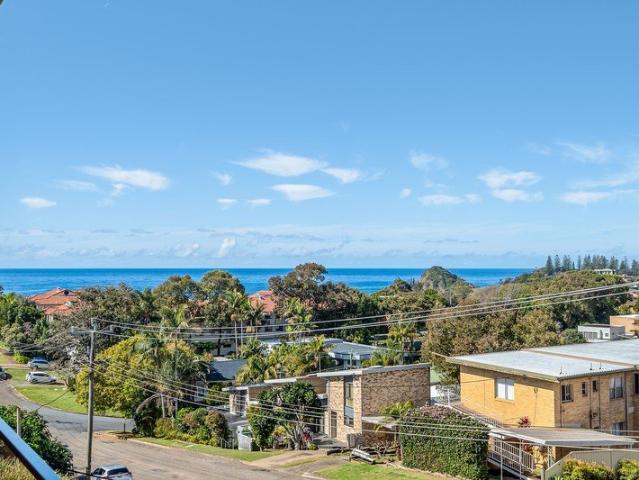 Steps from Flynns Beach, with sweeping ocean views